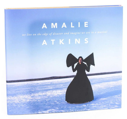 We live on the edge of disaster and imagine we are in a musical - Amalie Atkins